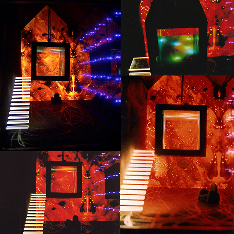 Interior Design_"House of Fire". Home project studio, set design for man artist, a surreal space created through the use of lighting. A unique environment that contains another inside: the cube. Each element represents a State of mind: chaos, rationality, madness, reflection, happiness and sadness. Lighting, materials and colours characterised each parts of the space underlining the contrast: black and white, cold and hot colour, metal and glass. A lit staircase leads to a more intimate and isolated room of the house, which represents the unconscious. This smaller cubic and suspended room is the house into the house.